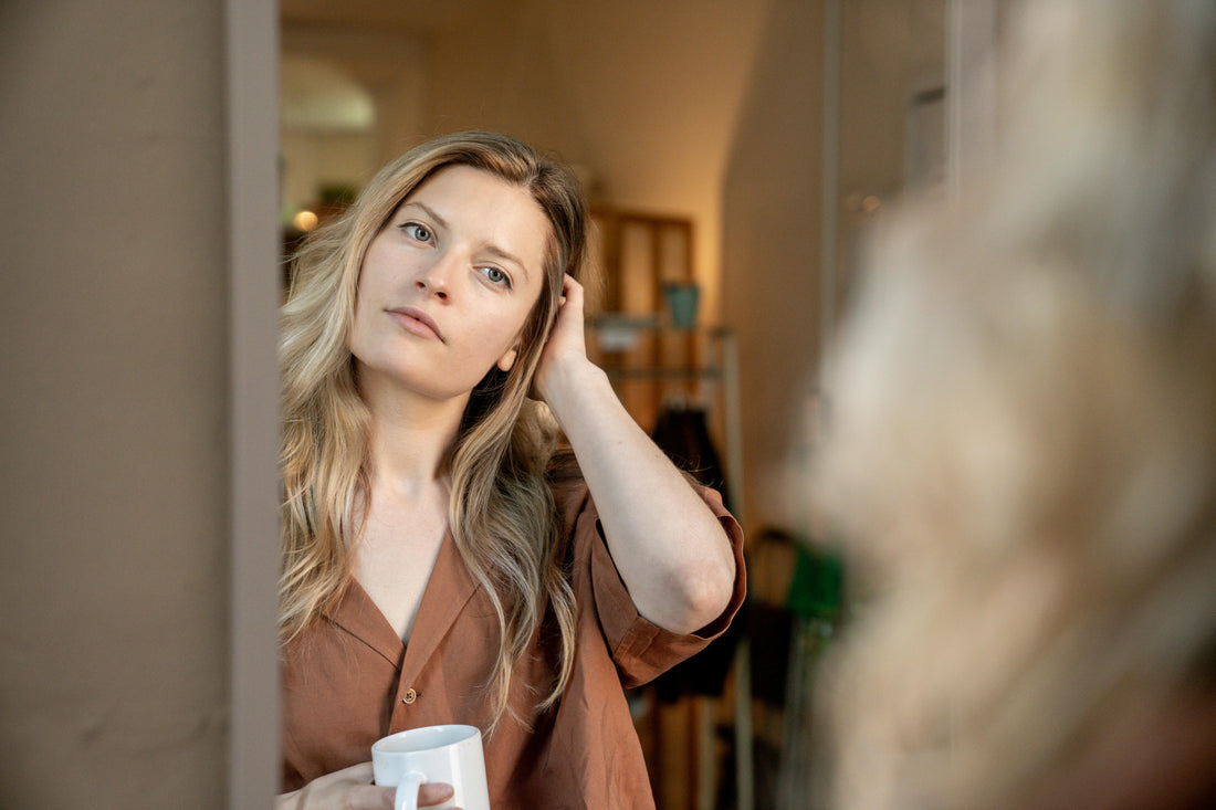 Thoughtful woman in her 40s noticing early perimenopause symptoms — what research says about hormonal changes after 40