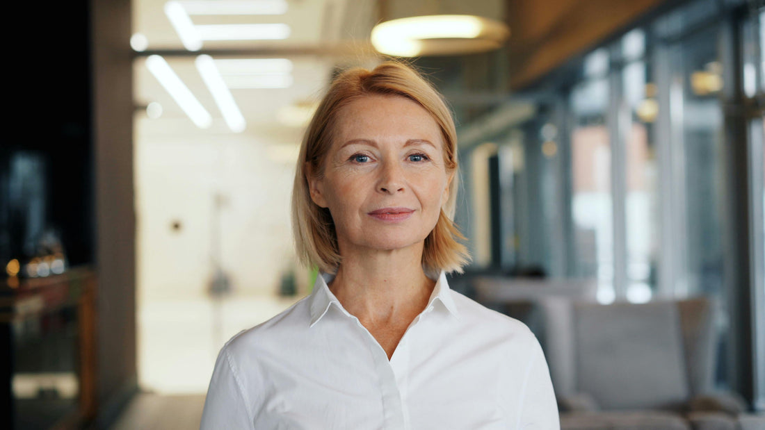 Woman in her 50s with calm, confident expression, representing the women VeraTenet supports through the menopausal transition.